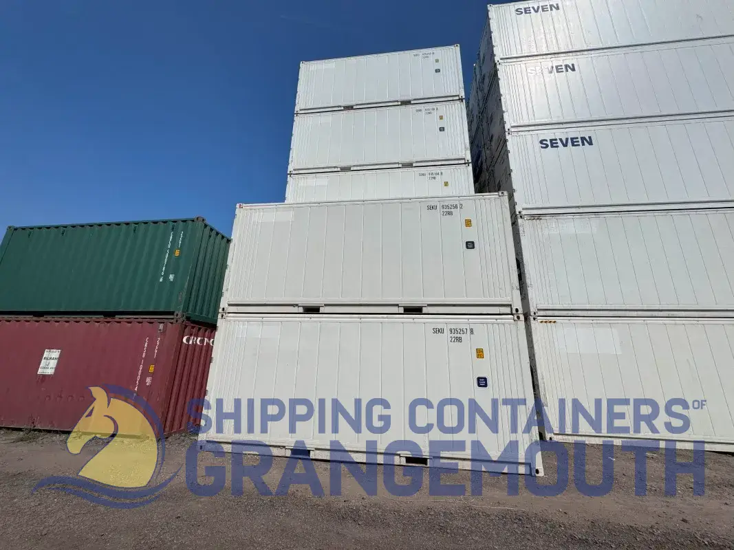 Stacked shipping containers in various colors against a clear blue sky, with a logo at the bottom.